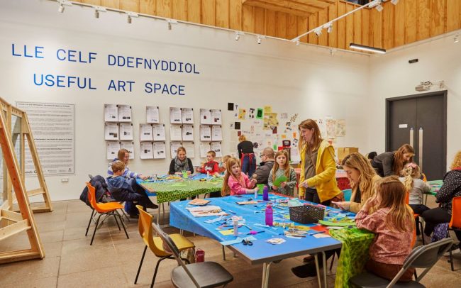 Families taking part in a craft activity in the Useful Art Space. Photo by Emli Bendixen.